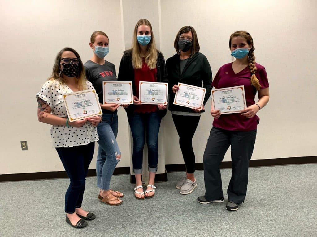Heather Quickle, Nicole Reding, Sarah Ruplinger, Kelly Robinson and Kaytlyn Schultz show their course completion certificate.