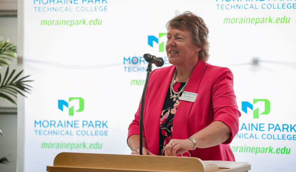 MPTC President Bonnie Baerwald at podium
