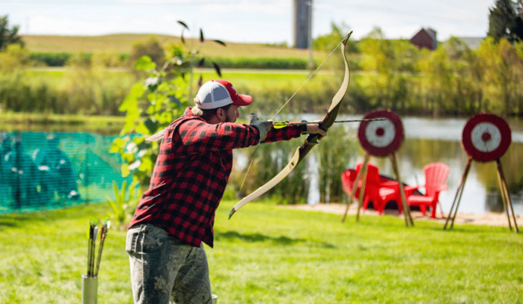 Man shooting bow and arrow