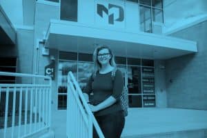 student in front of fdl campus