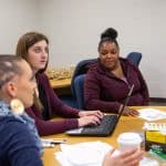 three female students in classroom