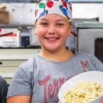 middle school students in culinary lab