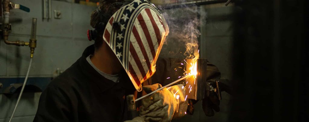welding student wearing a helmet