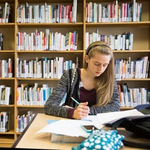 female student in library