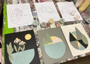 Painted canvas images of landscapes, flowers, and shapes