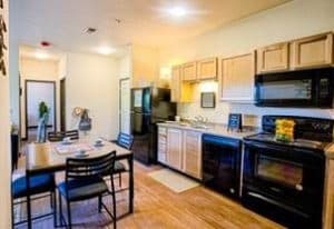 Interior of Vue Student Housing Apartment. View of Kitchen.