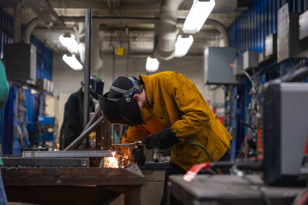 Welding student at work in the workshop.