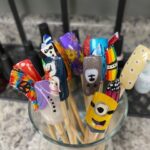 Colorful nails glued to wooden sticks.