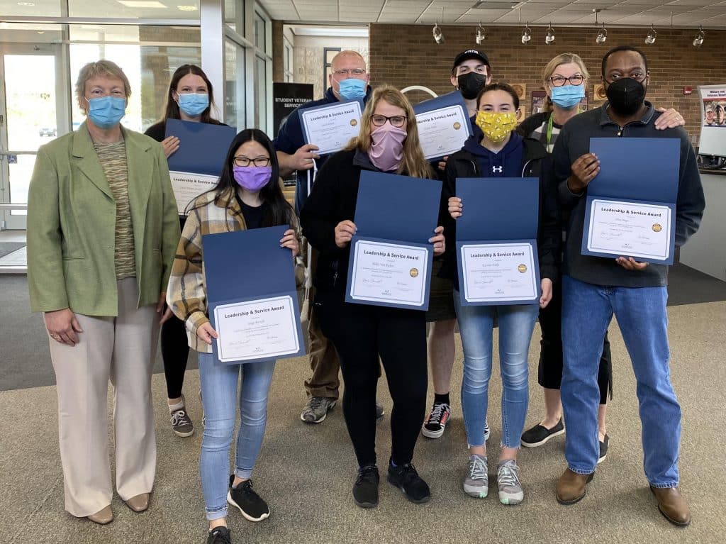 District Student Ambassador Award recipients standing next to Moraine Park President Bonnie Baerwald.