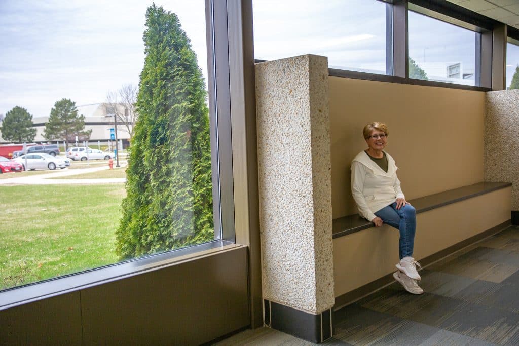 Peggy sitting at the same spot in 2022.