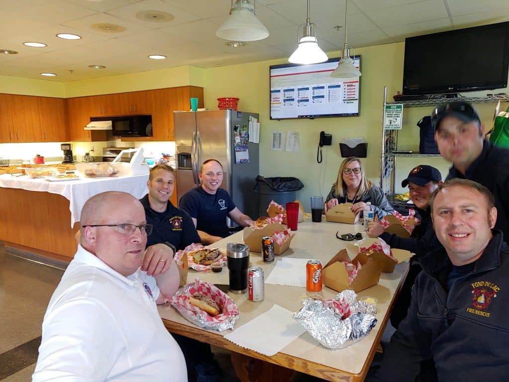 Culinary Arts students serving EMTs lunch.