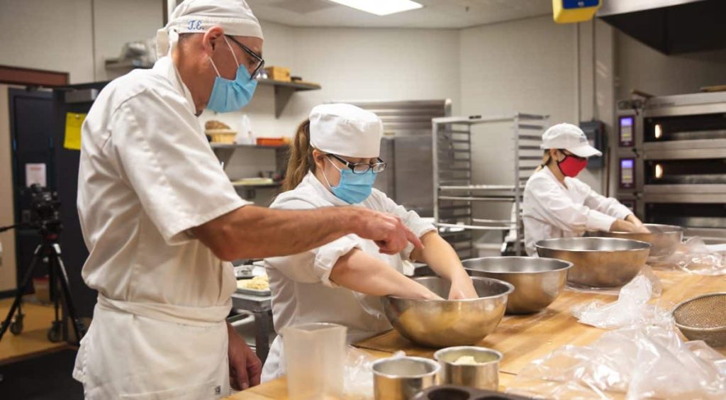 Culinary students prep for Fondue Fest in the kitchen.