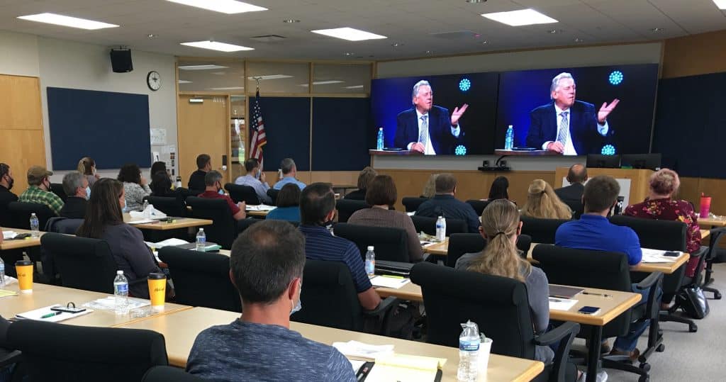 Participants of Live2Lead in a conference room listening to a presenter.
