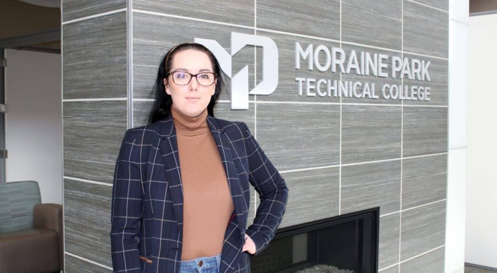 Malinda Moore standing in the Moraine Park Fond du Lac lobby.