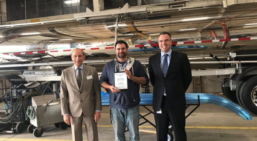 Group photo of two Moraine Park members and award winner Nathan Glander of Wabash National.