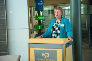 Moraine Park President Bonnie Baerwald speaking at the podium.