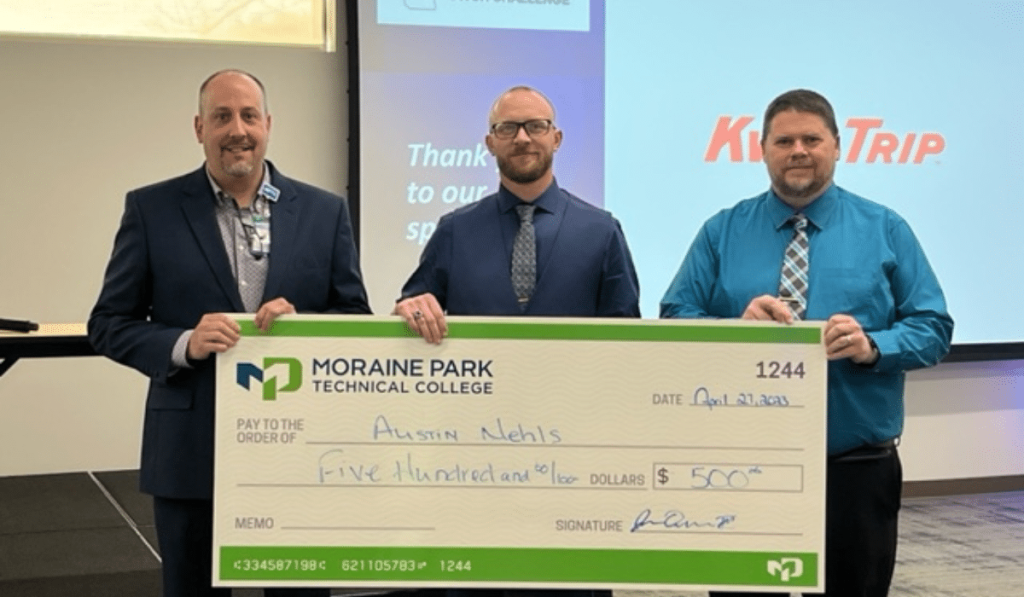 Austin Nehls receiving check