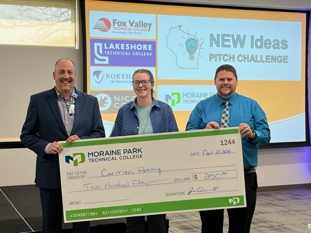 Carmen receiving check