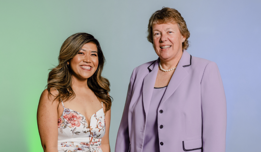 Moraine Park student, Mailia Bachleitner, standing next to Moraine Park President Bonnie Baerwald. Both are smiling into the camera.
