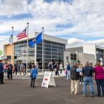 People standing in from of the new Horicon Regional Center and happily chatting with each other.