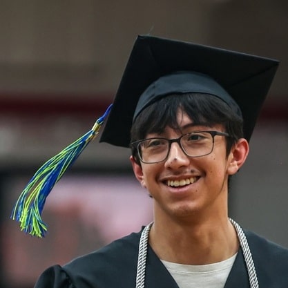 Happy Moraine Park student in graduation gown.