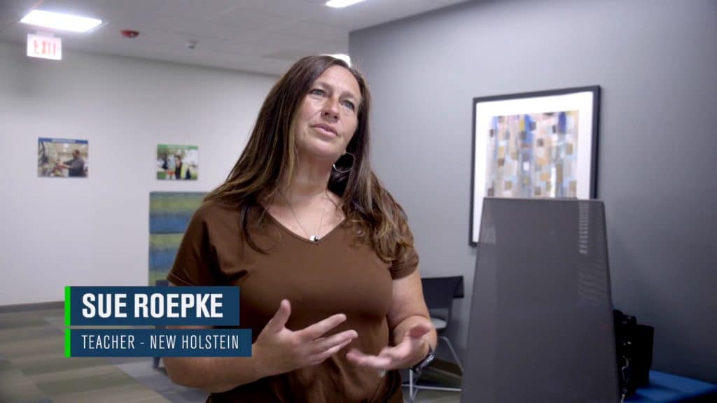 Sue Roepke, teacher at New Holstein high school, is talking about her dual credit students to the camera.