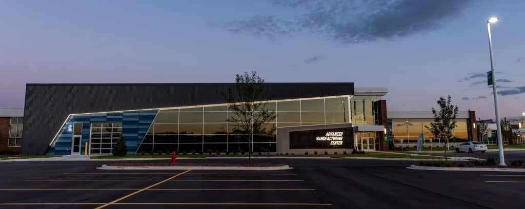 Outside view of the Advanced Manufacturing Center on Moraine Park's West Bend Campus at night.