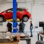 Automotive Technology students inspecting a car.