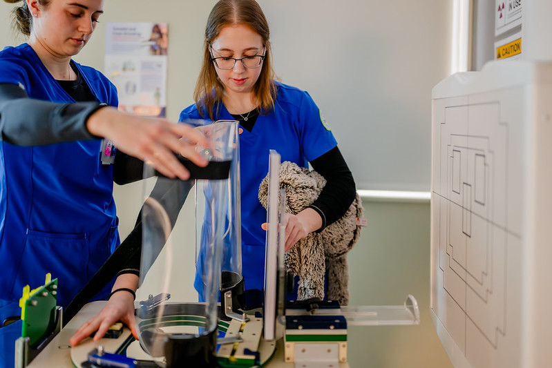 Two Radiography students working in a lab setting