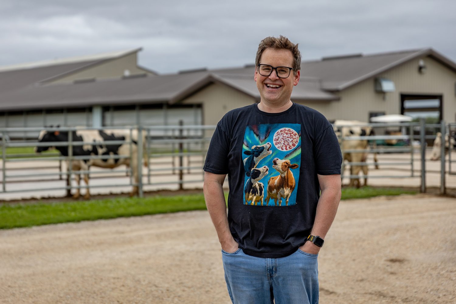 Owner of Poco Pizza standing in front of his farm