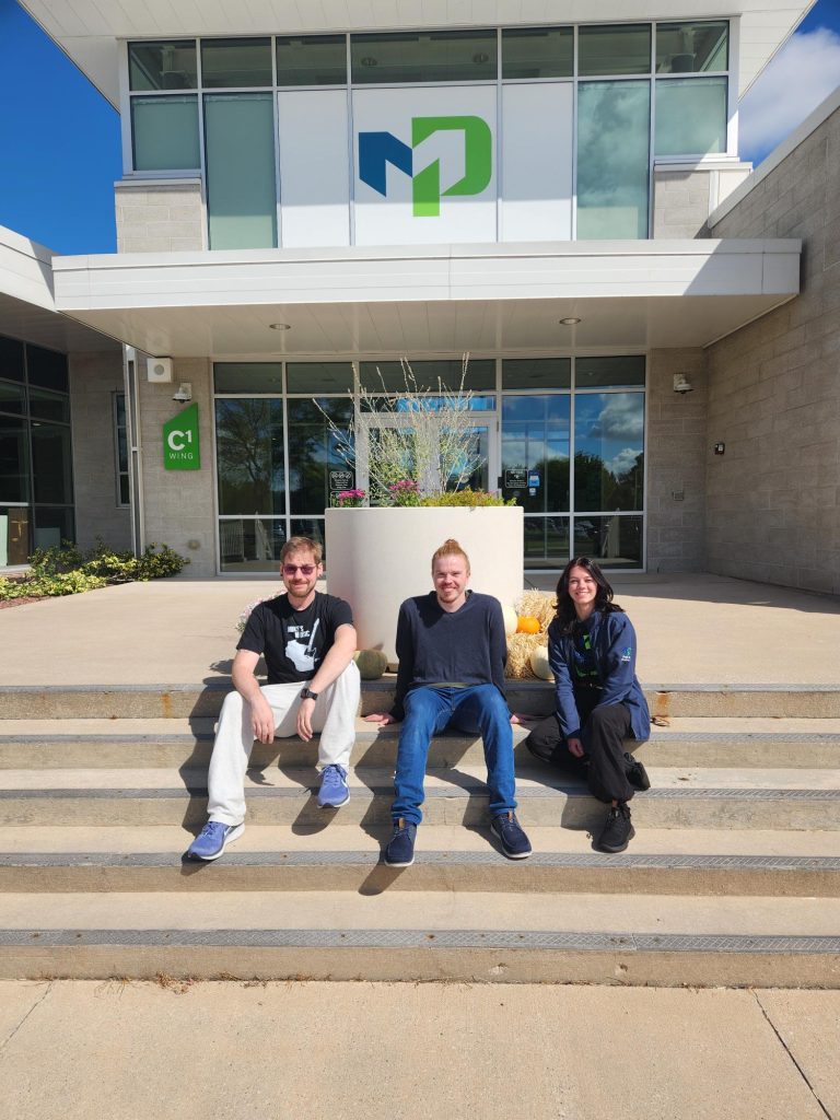From left to right: Vice President Zachary Schultz, President Jacob Schreiber and Secretary Cynthia Benzel smiling outside of the Fond du Lac main entrance.