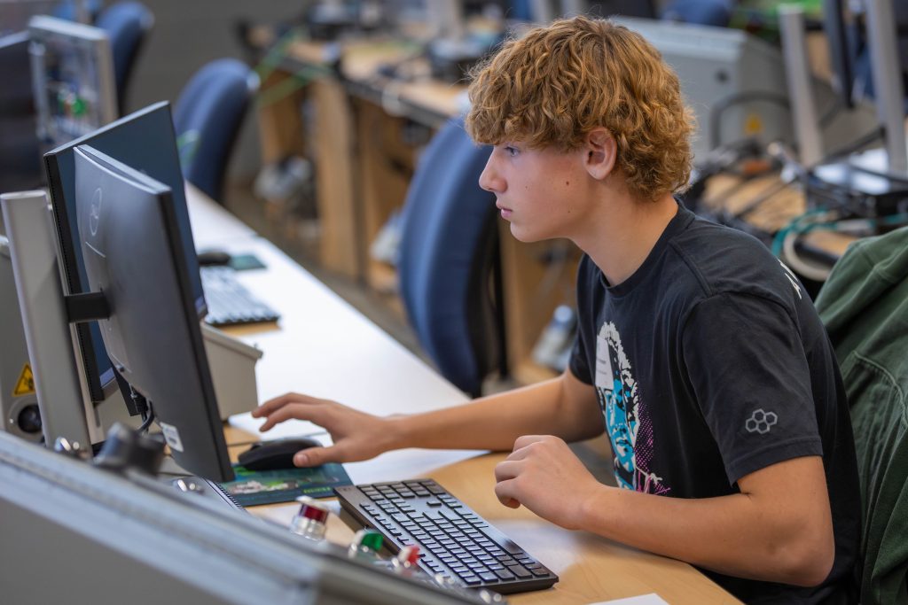 Student working on a desktop computer.