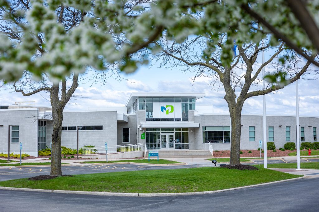 Moraine Park's Fond du Lac Campus in the Spring with flowers.