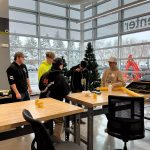 High school students working on on yellow PCP pipes to learn more about the Moraine Park Gas and Utilities program