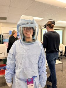 Moraine Park surgical Technology Student trying on surgery PPE.