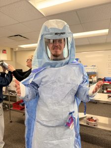 Moraine Park surgical Technology Student trying on surgery PPE.