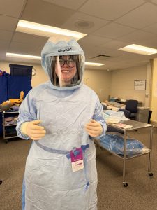 Moraine Park surgical Technology Student trying on surgery PPE.