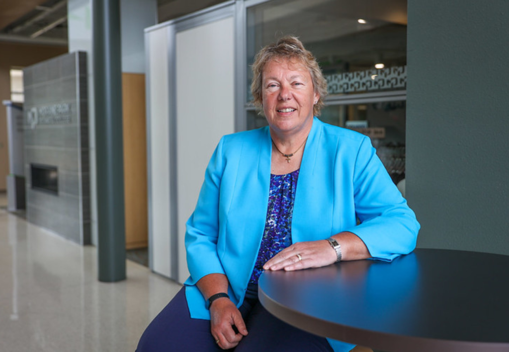 President Bonnie Baerwald smiling on campus