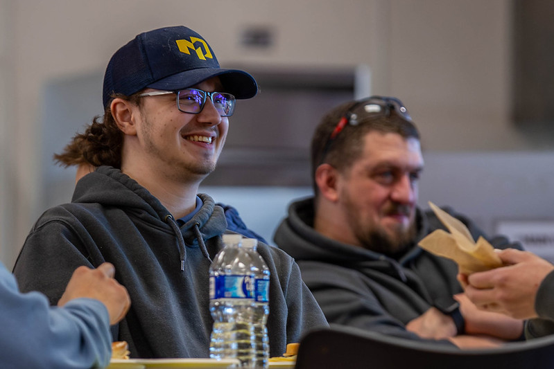 Students smiling on campus during Welcome Back Week.