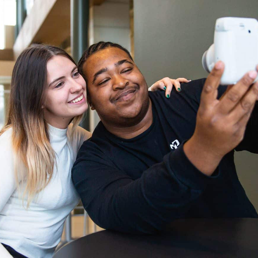 Two students taking a photo together
