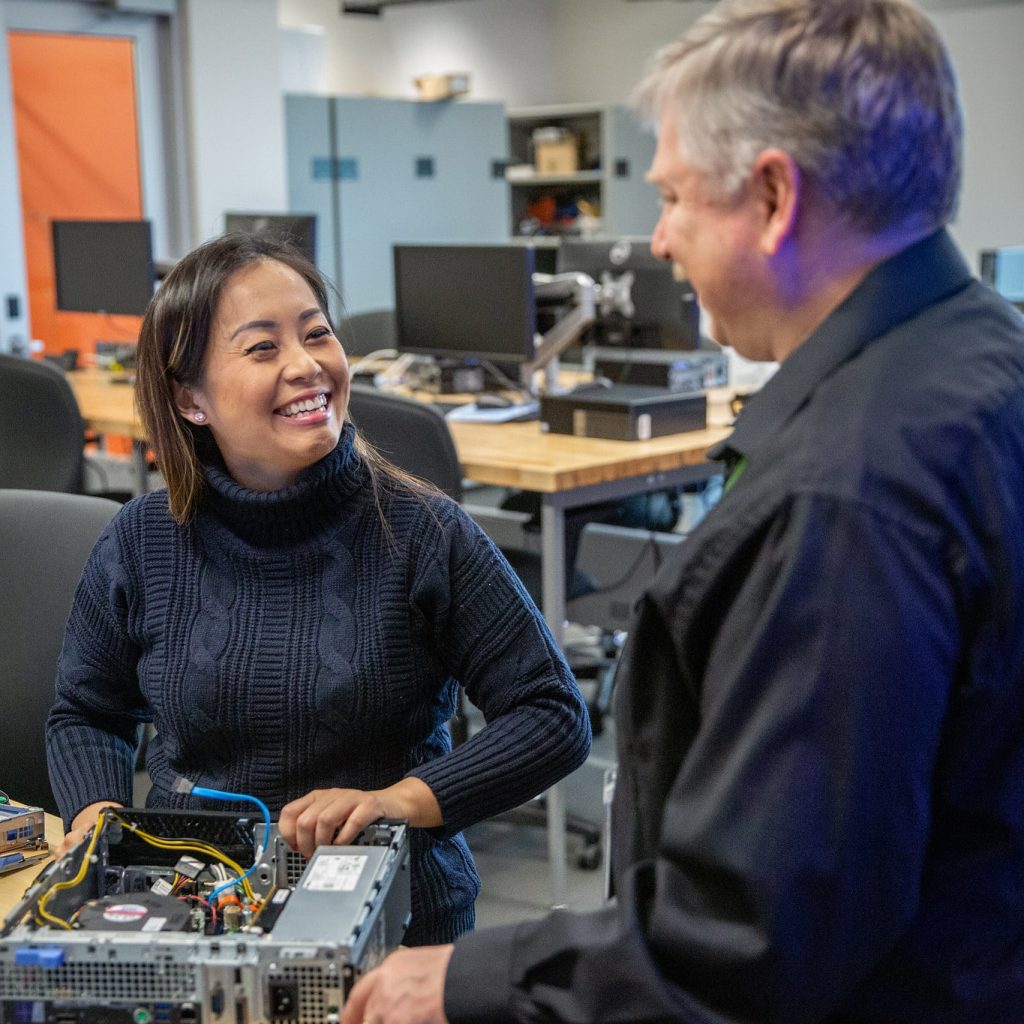 Student and instructor working in an IT classroom