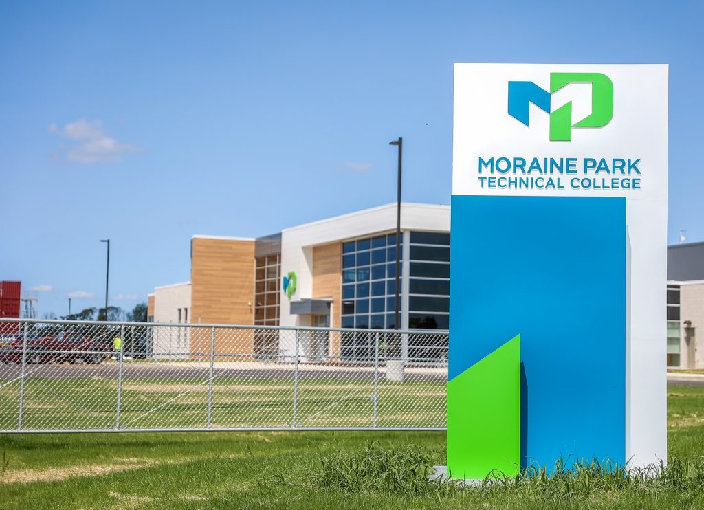 The exterior of the Horicon Regional enter with Moraine Park signage on a sunny day.