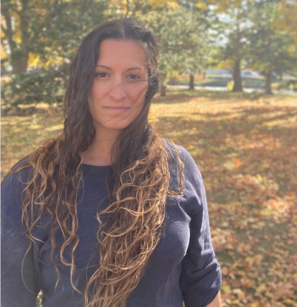 CL Wellness - Coaching with Cassandra Logo which is a head shot of Cassandra in a park during fall.