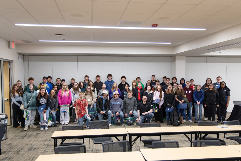 Group photo of 55 students smiling at Moraine Park.