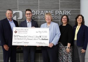 SSM Health presents a large $250,000 check donation to MPTC for their Health and Human Services Campaign.