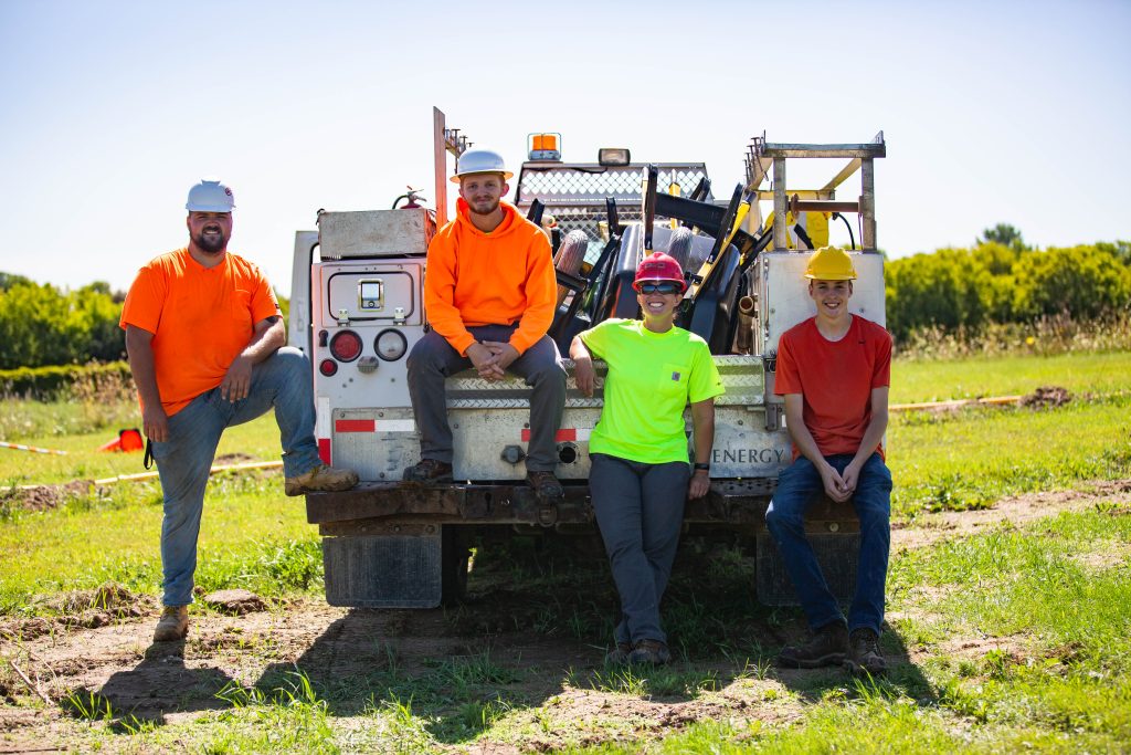 Four MPTC construction students smiling at the camera
