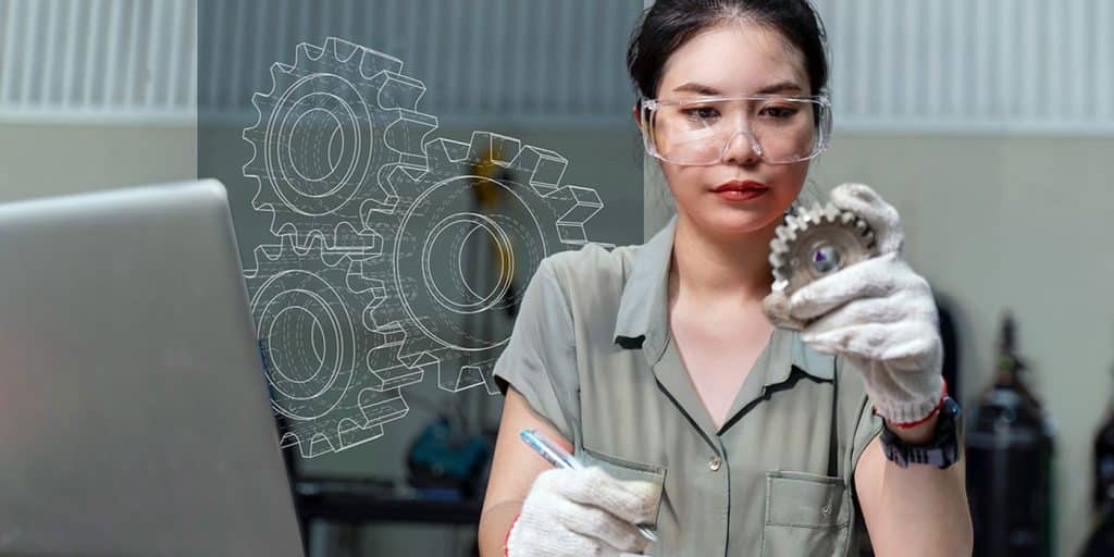 An engineer reviewing metal products.