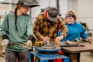Manufacturing students working together in a lab