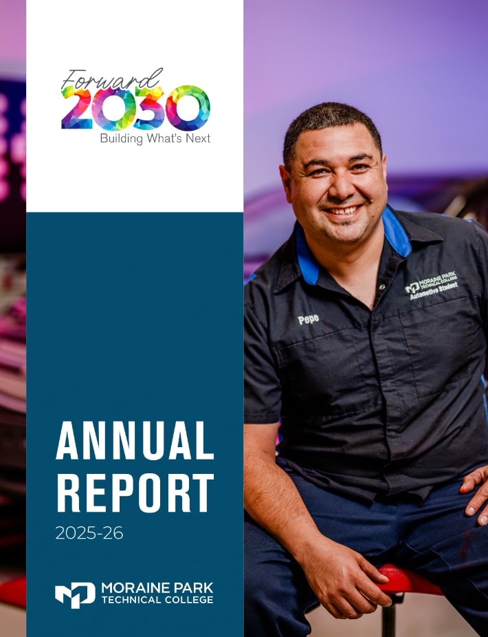 Front cover or Moraine Park Technical College's Annual Report featuring a smiling automotive student.